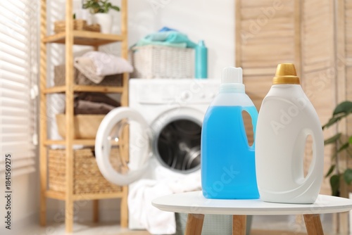 Laundry detergents on white table indoors, space for text
