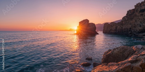 Fototapeta Naklejka Na Ścianę i Meble -  Winter coastal scene at dawn with calm waters and clear sky, ideal for editorial header background