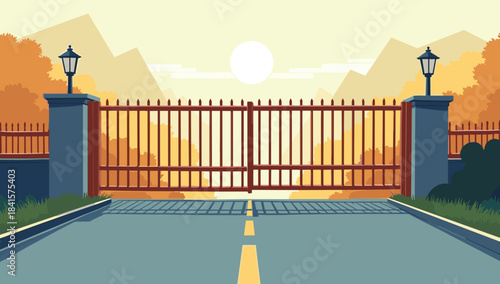 Road closed metal gate before mountains in warm evening light