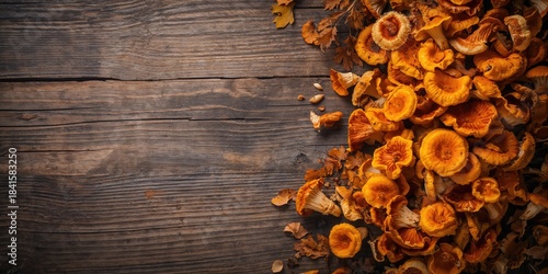 Chanterelle mushrooms on rustic wooden surface, foraging or culinary preparation, World Mushroom Day