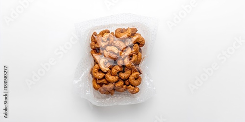 Cashews sealed in plastic packaging with air bubble wrap on a white background, highlighting packaging safety