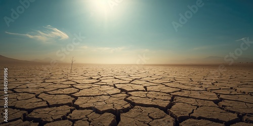 Dry cracked earth surface indicating drought conditions, climate change and water scarcity awareness