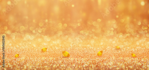 Foto Banner of Golden scattered golden diamonds and shimmering glitter with soft bokeh lights and sparkling textured background, creating a warm luxury abstract backdrop perfect for festive, celebration