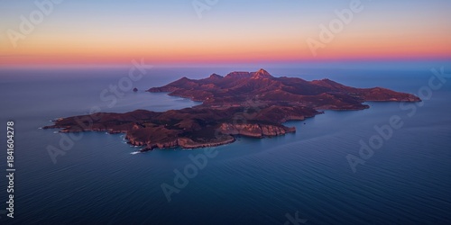 Aerial view of islands at sunset with water and mountain scenery, ideal for travel and nature backgrounds