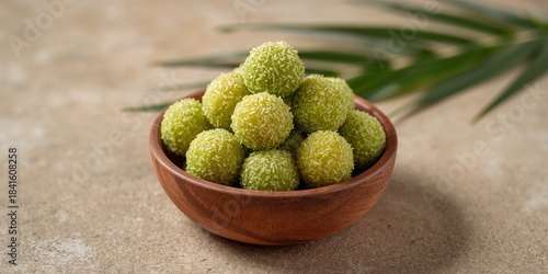 Kelepon rice cake balls filled with molten palm sugar and coated in grated coconut, highlighting traditional snack preparation