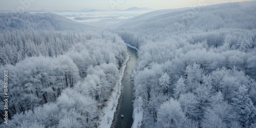 Fototapeta Naklejka Na Ścianę i Meble -  Bird's-eye perspective of snow-covered Poprad Landscape Park in Beskid Sadecki during winter, emphasizing seasonal change