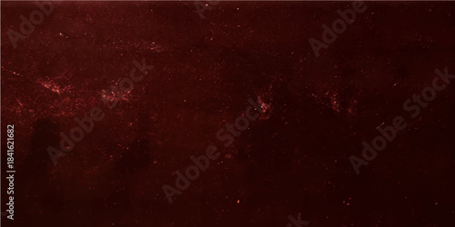 Old, rough red grunge texture backdrop featuring a dark, distressed vintage paper pattern with an aged, metallic surface design