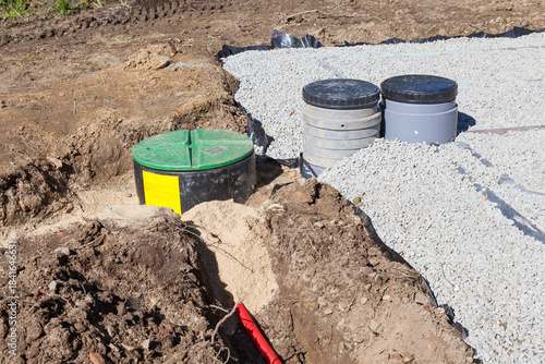 Installing the pump, wiring, sand and gravel filter bed  and filters on a domestic septic tank  for treatment of sewage and waste water