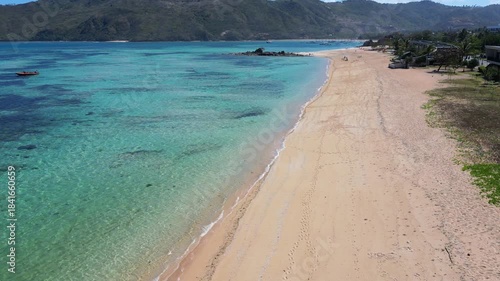 Lombok, Indonesia, Beach ocean drone aerial view landscape at Mandalika beach area. Tropical island beach aerial landscape with ocean