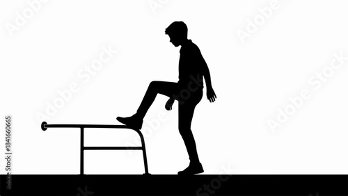 Silhouette of person stepping up onto platform. Figure demonstrates focus, effort, and determination while stepping up. Concept of person stepping up symbolizing challenge, progress,