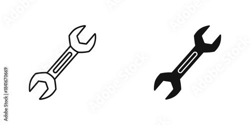 Set of two wrench icons, outline and filled silhouette, isolated on