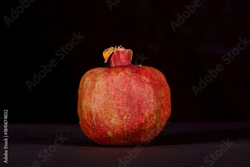 pomegranate on black background