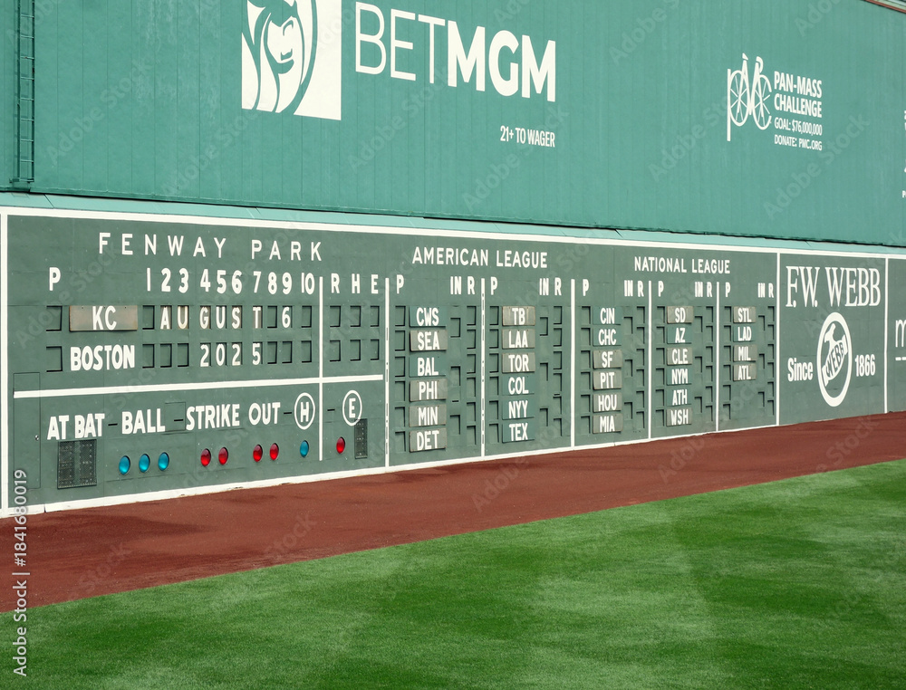 Fototapeta premium Boston, MA - USA - 08-06-2025: The scoreboard and green monster left field wall at Fenway Park, home of the Boston Red Sox Major League Baseball team