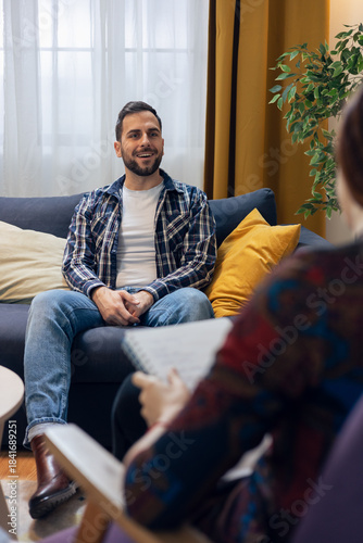 Man talking during psychotherapy session with therapist