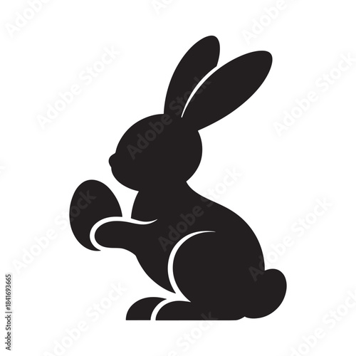 A minimalist black silhouette illustration of an easter bunny holding a single egg