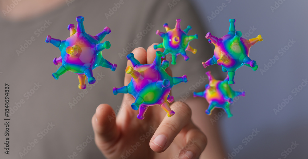 Fototapeta premium Abstract image of a hand interacting with a computer generated colorful virus, representing disease, innovatio