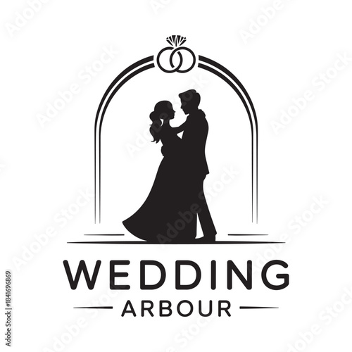 Romantic wedding silhouette of a couple embracing under an arched frame with rings