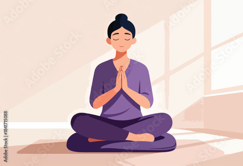 Woman in purple attire meditating peacefully in a sunlit room, hands pressed together