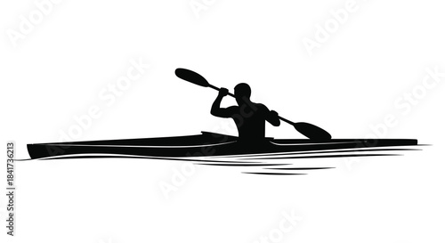 A lone kayaker paddling on water a striking black form against the light silhouette