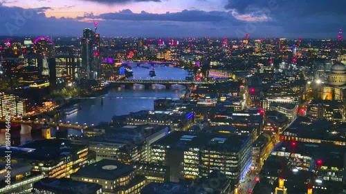London, 2025: Night view of London, London Bridge, River Thames and west part of city at sunset 