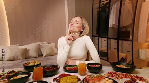 Beautiful girl eating with pleasure