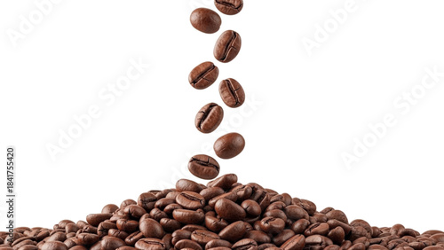 Roasted coffee beans falling and spilling onto a large pile, isolated on a white background