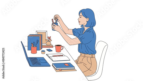 A woman organizing her desk with pens, books and laptop: study, work and clean up scene