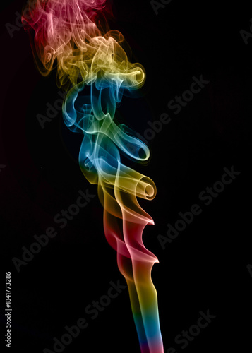 Vibrant Rainbow Smoke Trails on Black Background. Abstract art photography