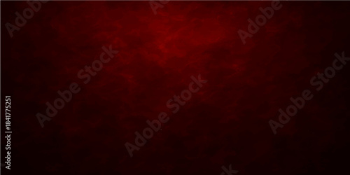 A dark red vintage grunge background features a textured paper pattern with an old paint design and grungy surface art perfect for a Christmas wallpaper or card backdrop