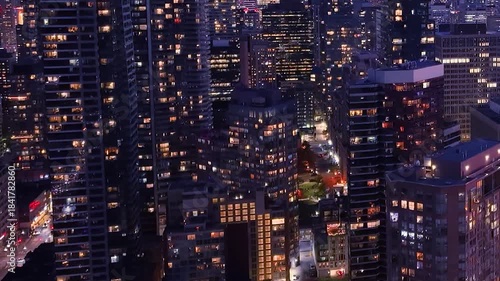 Drone view of the evening Toronto skyline. City lights. Downtown skyscrapers viewed from above. Toronto, Ontario, Canada.