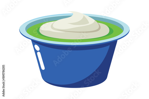 A blue container with green filling and a swirl of cream rests on white