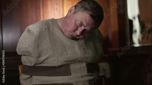 The glass reflection became the only witness to his powerlessness. A drunkard is locked in his own mind, where the walls are despair.Mentally ill person