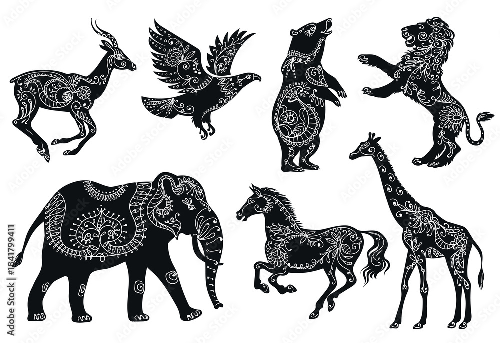 Fototapeta premium Animalistic floral silhouettes. Black fauna shapes with flowers patterns, boho style animals, ethnic oriental ornaments, wildlife elephant, horse and giraffe. Splendid vector cartoon flat set