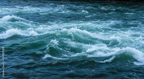 Turbulent water in a fast-moving river creating white foam and strong currents, demonstrating speed and dynamic natural power ,dynamic ,motion ,wild