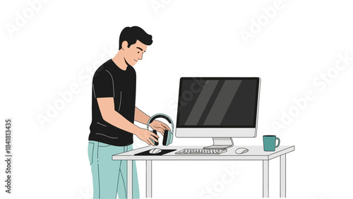 Man setting up headphones on a computer desk, working or using audio equipment