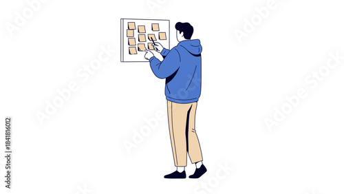 Person brainstorming concepts on a whiteboard covered in sticky notes and ideas