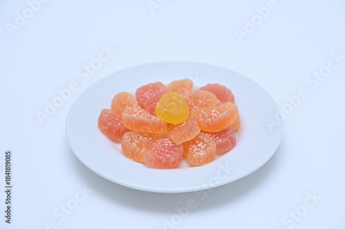 Sweets colorful homemade marmalade on a plate on a white background