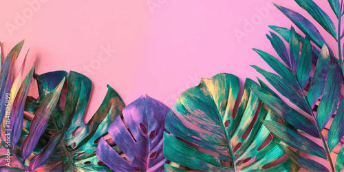 Vibrant tropical leaves illuminated with neon pink and turquoise lighting against a soft pink background