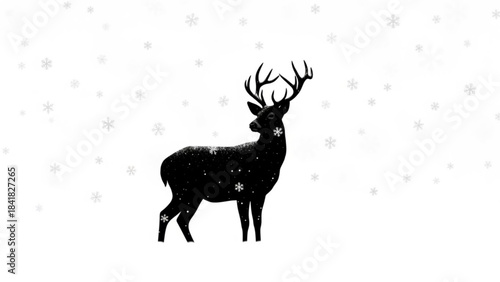 Black silhouette of a deer with antlers on with snowflakes