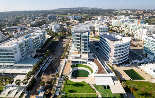 Holiday Resort complex with modern architecture and green pools. Protaras, Cyprus