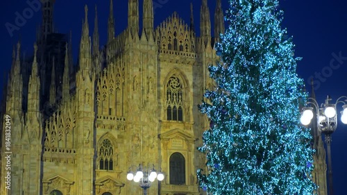 Panorama of Piazza Duomo with New Year and Christmas tree. Albero di Natale with colored lights. City at night. Vacations and shopping. One night ahead. Multi-colored lights.
Milan, Italy, 11.12.2025