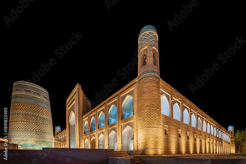  Night view of the Muhammad Amin Khan Madrasa with the incomplete memorial Kalta Minor minaret, UNESCO World Heritage Site, Khiva, Uzbekistan 
