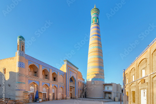 The Islam Khodja Madrasa with its high minaret in the light of dawn, UNESCO World Heritage, Khiva, Uzbekistan
