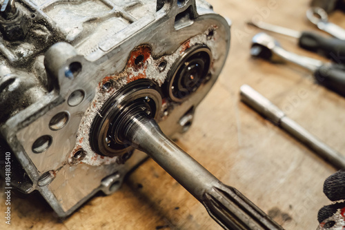 Fotografija Disassembled old car gearbox with gears in an auto service garage