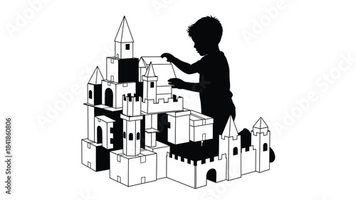 A young boy silhouetted against a bright background intently builds a magnificent castle from blocks