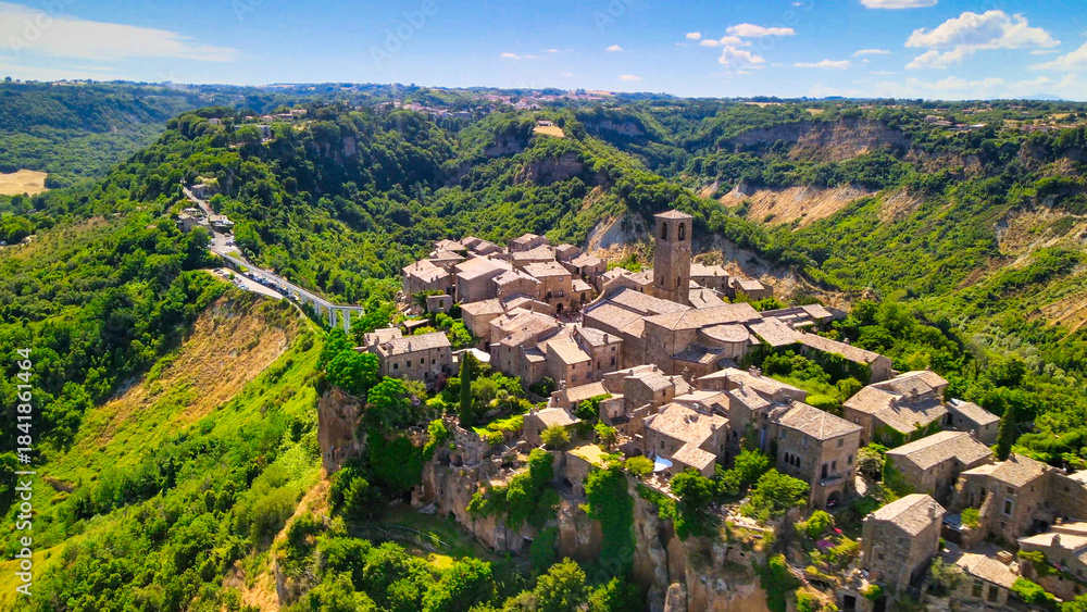 Fototapeta premium Approaching medieval town of Civita di Bagnoregio from a drone, Italy.