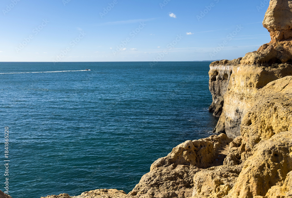 Naklejka premium Part of the Algar Seco Cliff Walk, over the eroded limestone cliffs close to Carvoeiro, Algarve, Portugal
