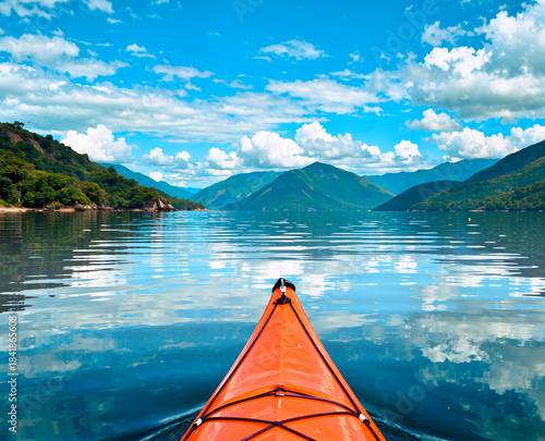 Orange kayak on lake
