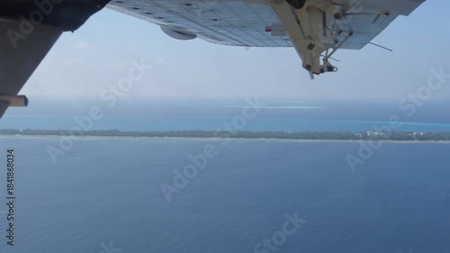Inflight POV Shot of Seaplane Approaching Maldivian Island with Flaps Extension
