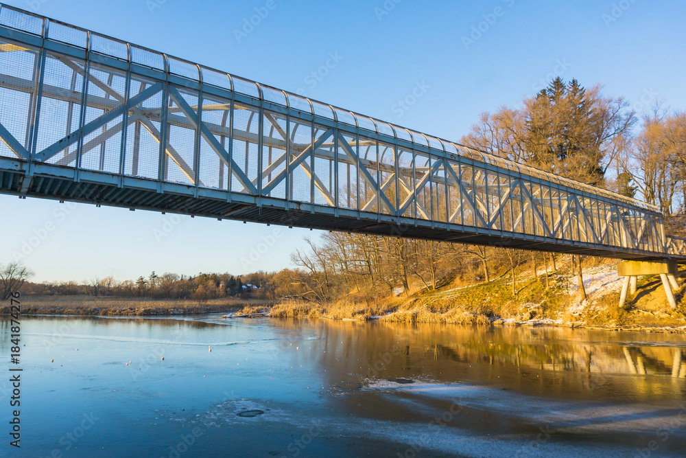 Fototapeta premium Bridge Over The River With Autumn Trees